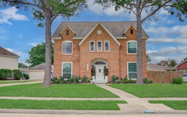 7826 Granite Ridge Ln, Houston, TX 77095 - colonial house featuring brick siding and roof with shingles