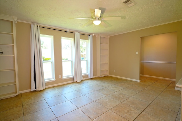 7354 Stone Pine Ln, Houston, TX 77041 - empty room featuring a textured ceiling, built in features, a ceiling fan, plenty of natural light, and light tile patterned floors