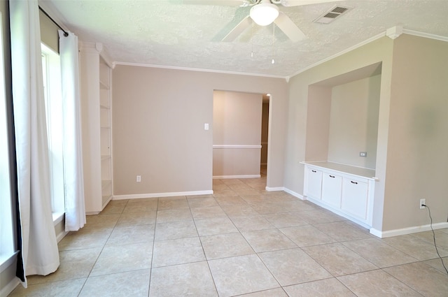 7354 Stone Pine Ln, Houston, TX 77041 - spare room with a textured ceiling, ceiling fan, light tile patterned floors, and ornamental molding