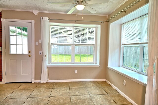 7354 Stone Pine Ln, Houston, TX 77041 - doorway featuring healthy amount of natural light, a textured ceiling, ornamental molding, a ceiling fan, and light tile patterned floors
