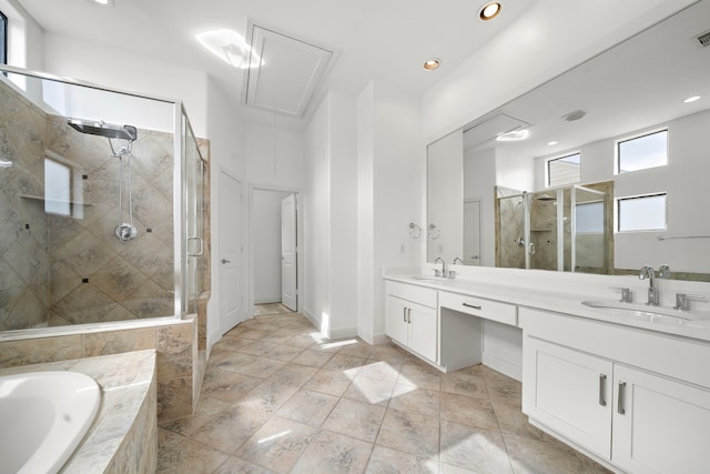906 Reinerman St, Houston, TX 77007 - full bath with double vanity, a shower stall, a garden tub, and recessed lighting