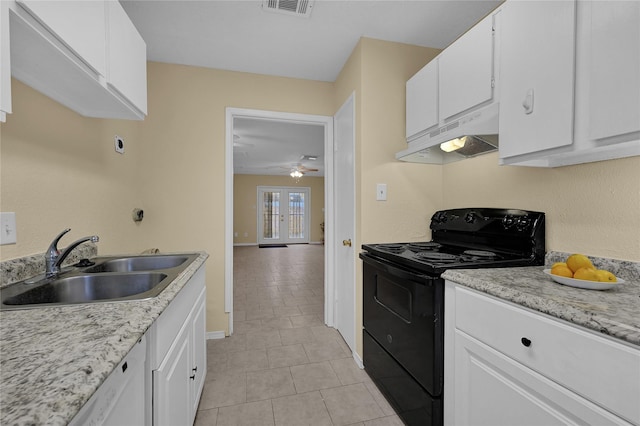 8405 Wilcrest Dr Unit 2800, Houston, TX 77072 - kitchen with electric range, under cabinet range hood, a ceiling fan, light tile patterned flooring, and white cabinets