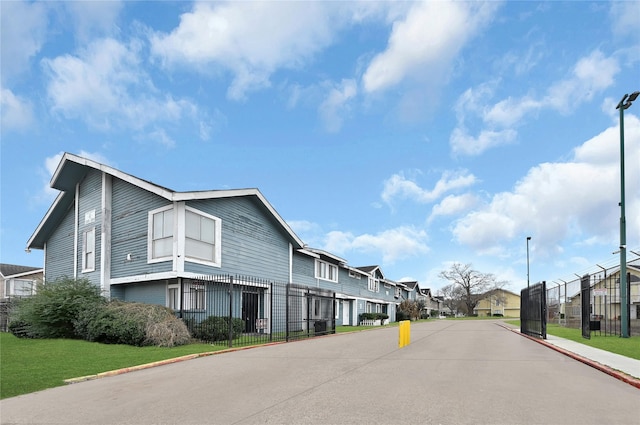 8405 Wilcrest Dr Unit 2800, Houston, TX 77072 - view of asphalt street featuring a residential view, street lights, and curbs