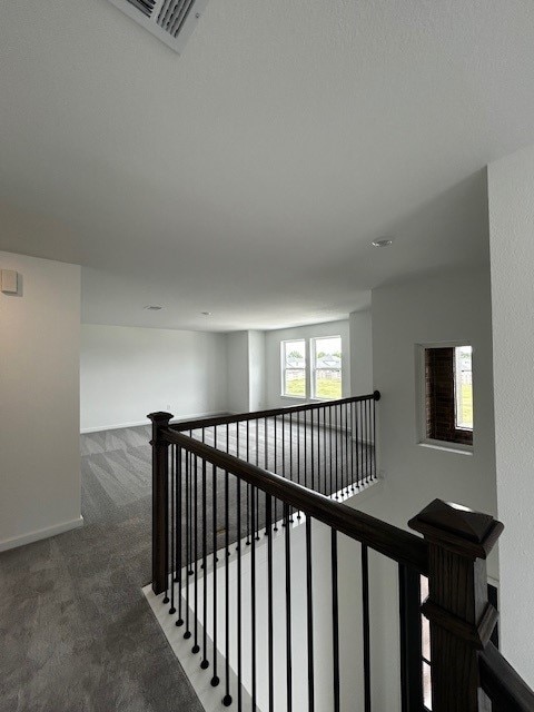 1123 Buffalo Run, Tomball, TX 77375 - stairs with carpet floors and baseboards