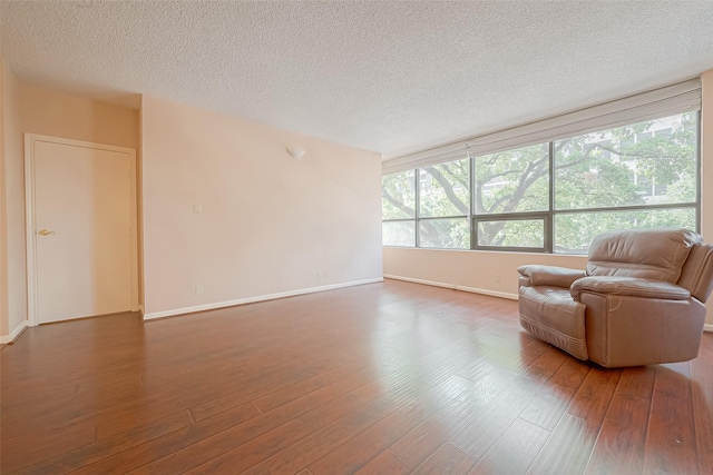 5150 Hidalgo St Unit 204, Houston, TX 77056 - living area featuring wood finished floors and a textured ceiling
