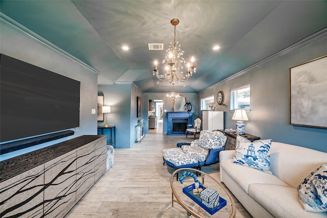 4019 Grennoch Ln, Houston, TX 77025 - living area with a chandelier, ornamental molding, wood finished floors, a fireplace, and recessed lighting