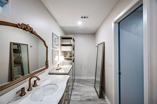 4019 Grennoch Ln, Houston, TX 77025 - bathroom with wood finished floors and vanity