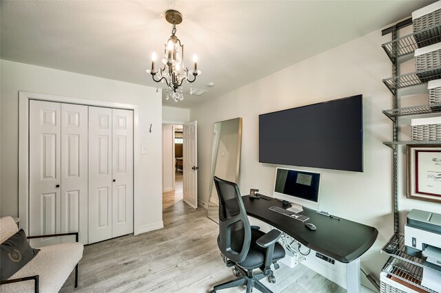 4019 Grennoch Ln, Houston, TX 77025 - office area with a chandelier and light wood-style flooring