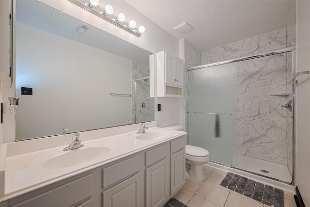 13703 Broad Oaks Ln, Rosharon, TX 77583 - full bath featuring a marble finish shower, double vanity, tile patterned flooring, and a textured ceiling