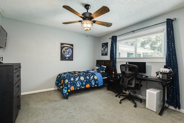 105 Pleasant Valley Dr, West Columbia, TX 77486 - carpeted bedroom featuring a desk, ceiling fan, and a textured ceiling