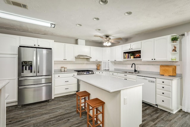 105 Pleasant Valley Dr, West Columbia, TX 77486 - kitchen featuring stainless steel appliances, open shelves, ceiling fan, white cabinetry, and recessed lighting