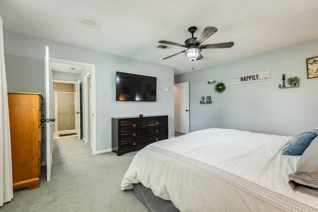 105 Pleasant Valley Dr, West Columbia, TX 77486 - bedroom with light carpet, a ceiling fan, and a textured ceiling