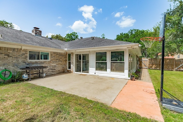 105 Pleasant Valley Dr, West Columbia, TX 77486 - rear view of property with a chimney, a gate, a patio area, and a shingled roof