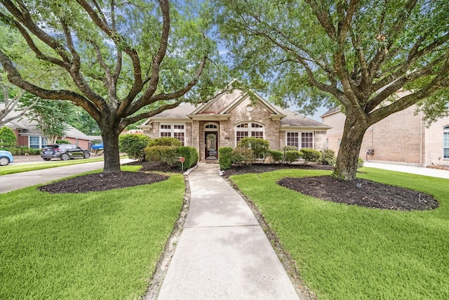 7110 Timber Post Ln, Humble, TX 77346 - traditional-style house featuring a front lawn