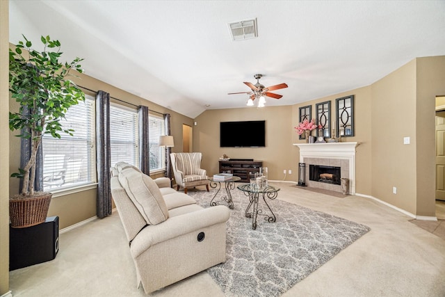 7110 Timber Post Ln, Humble, TX 77346 - carpeted living room featuring a ceiling fan, a tiled fireplace, and lofted ceiling