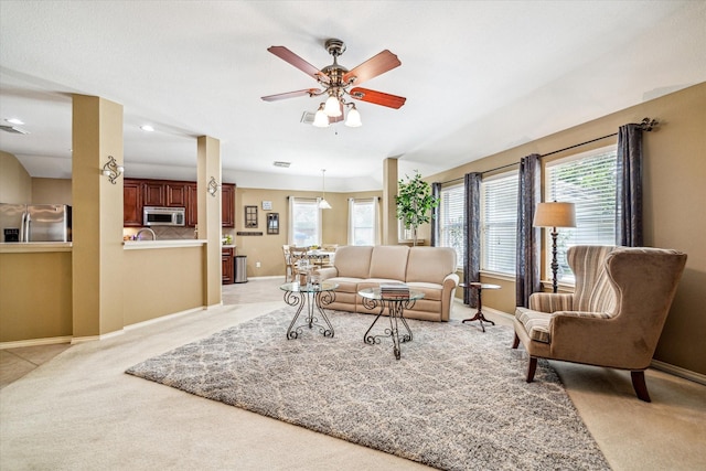 7110 Timber Post Ln, Humble, TX 77346 - living area with light carpet, healthy amount of natural light, a ceiling fan, and recessed lighting