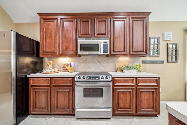 7110 Timber Post Ln, Humble, TX 77346 - kitchen featuring stainless steel appliances, light countertops, and decorative backsplash