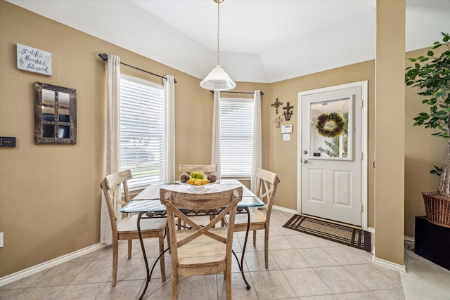 7110 Timber Post Ln, Humble, TX 77346 - dining area featuring lofted ceiling and light tile patterned floors