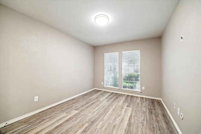7110 Timber Post Ln, Humble, TX 77346 - spare room with wood finished floors and baseboards
