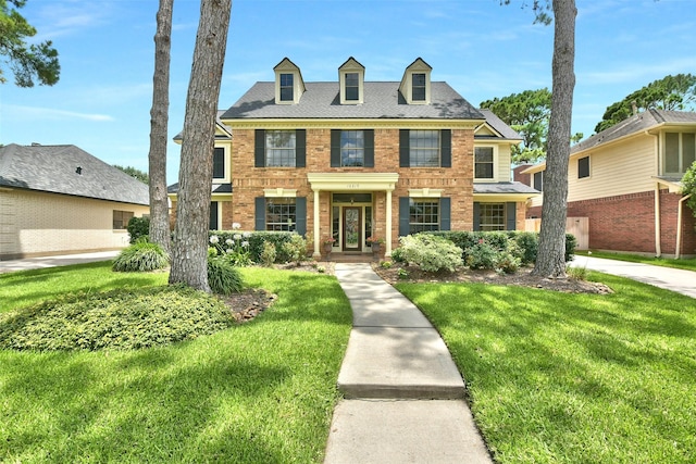 16219 Rainbow Lake Rd, Houston, TX 77095 - colonial inspired home featuring brick siding and a front yard
