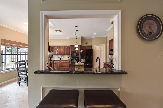16219 Rainbow Lake Rd, Houston, TX 77095 - kitchen featuring black appliances, a peninsula, crown molding, pendant lighting, and light tile patterned flooring
