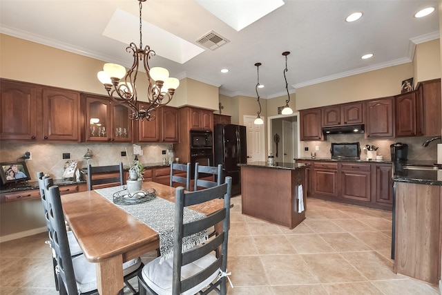 16219 Rainbow Lake Rd, Houston, TX 77095 - kitchen with under cabinet range hood, black appliances, a center island, light tile patterned floors, and recessed lighting