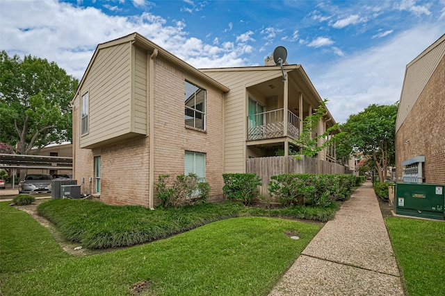 700 Thicket Ln Unit 306, Houston, TX 77079 - view of side of home with a lawn and brick siding