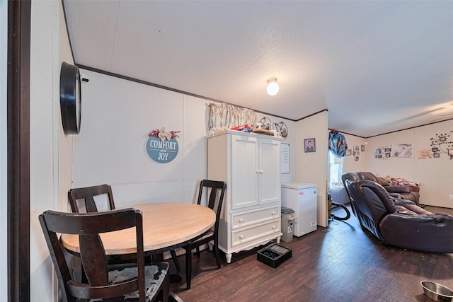 232 3rd St, Dickinson, TX 77539 - dining space featuring dark wood-style flooring and a textured ceiling