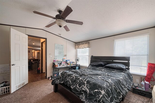 232 3rd St, Dickinson, TX 77539 - carpeted bedroom featuring vaulted ceiling, a textured ceiling, a ceiling fan, and ornamental molding