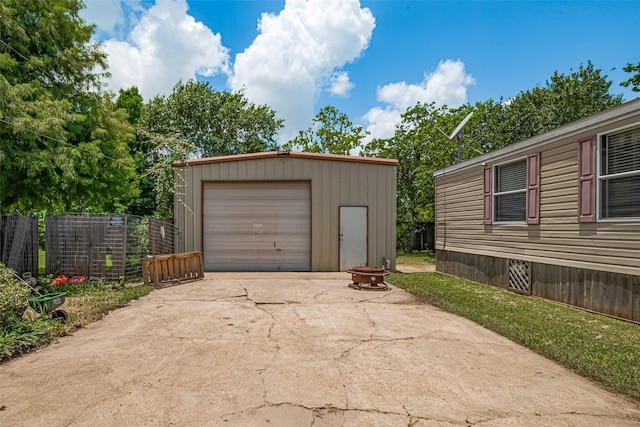 232 3rd St, Dickinson, TX 77539 - detached garage featuring concrete driveway