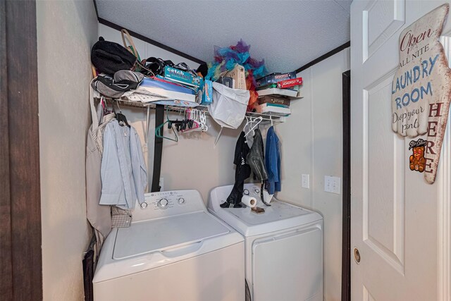 232 3rd St, Dickinson, TX 77539 - washroom with independent washer and dryer and a textured ceiling