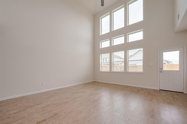 10023 Rose Mallow Ln, Magnolia, TX 77354 - foyer with high vaulted ceiling and light wood finished floors
