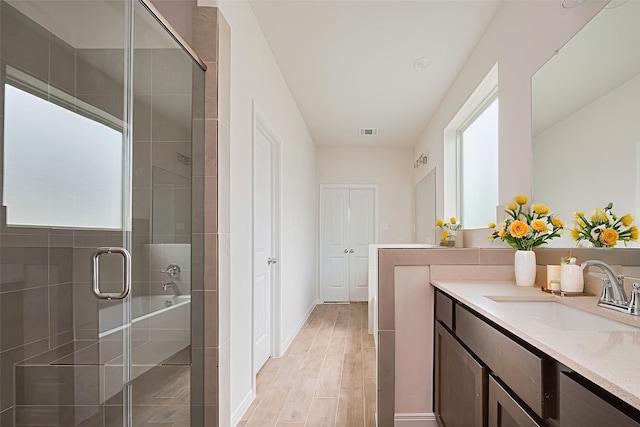 10023 Rose Mallow Ln, Magnolia, TX 77354 - full bath with vanity, a stall shower, and wood finished floors