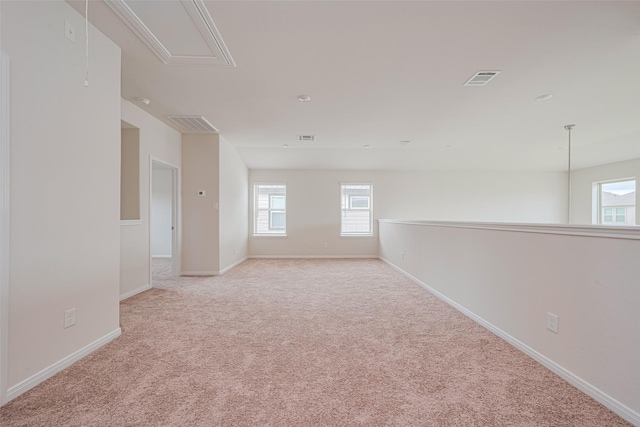10023 Rose Mallow Ln, Magnolia, TX 77354 - spare room featuring attic access, healthy amount of natural light, and carpet