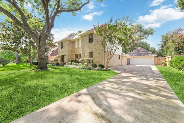 18307 Cransley Dr, Houston, TX 77084 - view of front of home featuring brick siding, a front yard, and a garage