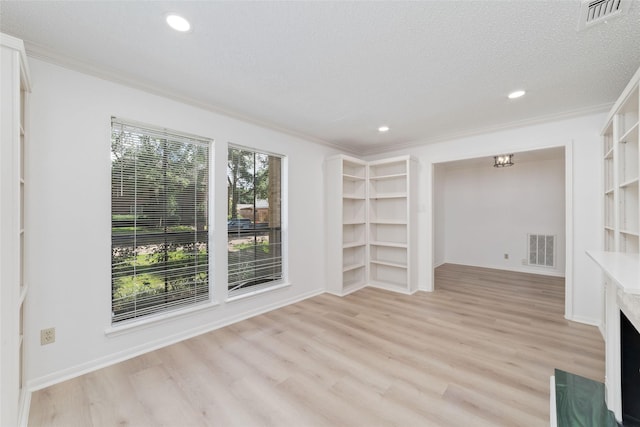 18307 Cransley Dr, Houston, TX 77084 - unfurnished living room with crown molding, light wood finished floors, and recessed lighting