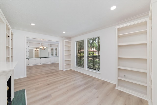 18307 Cransley Dr, Houston, TX 77084 - unfurnished living room featuring a chandelier, light wood-type flooring, built in features, crown molding, and recessed lighting