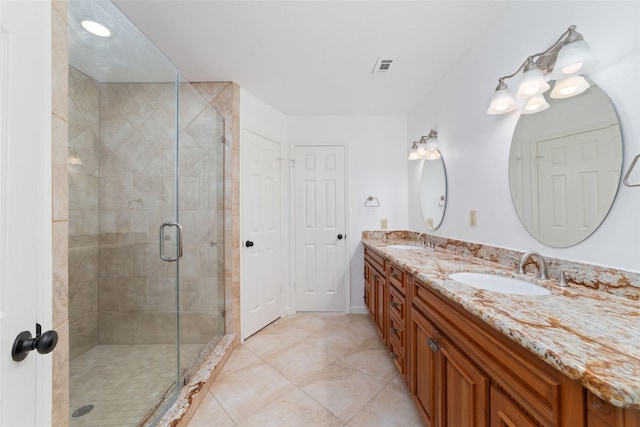 18307 Cransley Dr, Houston, TX 77084 - full bathroom with double vanity, a stall shower, and tile patterned floors