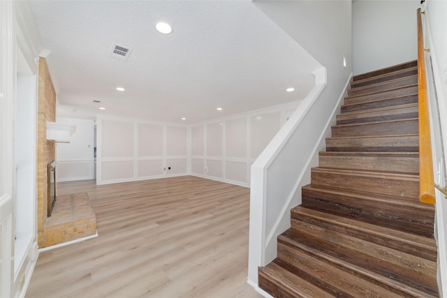 18307 Cransley Dr, Houston, TX 77084 - stairs with wood finished floors and recessed lighting