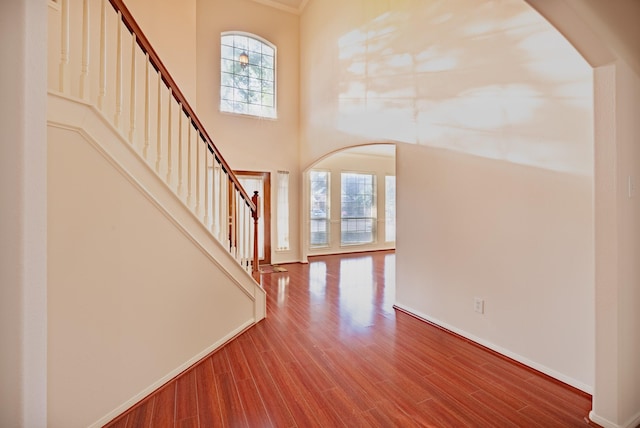 7907 Swan Hollow Ct, Houston, TX 77041 - entryway featuring arched walkways, stairway, healthy amount of natural light, and a towering ceiling