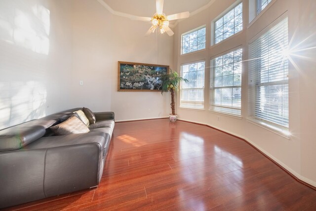 7907 Swan Hollow Ct, Houston, TX 77041 - living area with a towering ceiling, wood finished floors, a ceiling fan, and crown molding
