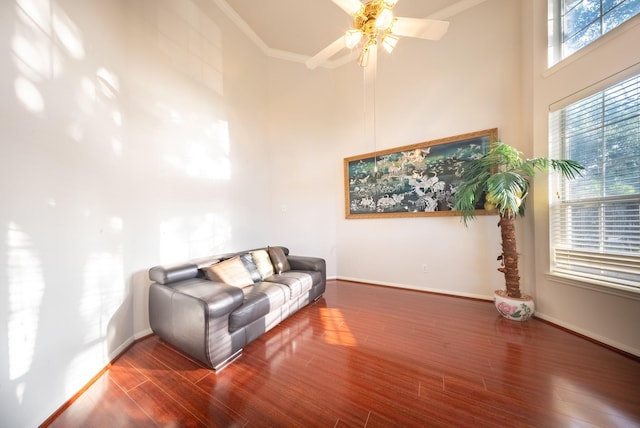 7907 Swan Hollow Ct, Houston, TX 77041 - living room with a towering ceiling, plenty of natural light, wood finished floors, a ceiling fan, and crown molding