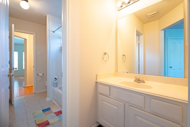7907 Swan Hollow Ct, Houston, TX 77041 - bathroom featuring vanity, tile patterned floors, and tub / shower combination