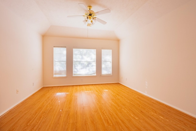 7907 Swan Hollow Ct, Houston, TX 77041 - spare room with light wood finished floors, a ceiling fan, and vaulted ceiling