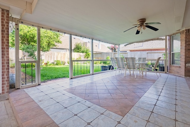 7907 Swan Hollow Ct, Houston, TX 77041 - unfurnished sunroom with outdoor dining area, ceiling fan, and plenty of natural light