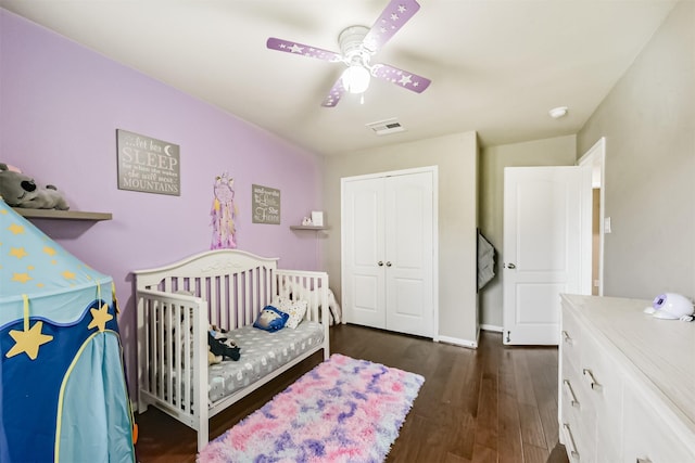 2012 Post Oak Ct, Pearland, TX 77581 - bedroom with a closet, dark wood-style flooring, ceiling fan, and a nursery area