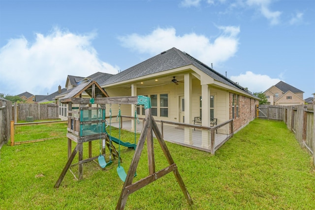 2012 Post Oak Ct, Pearland, TX 77581 - rear view of property featuring a fenced backyard, ceiling fan, a playground, and roof with shingles