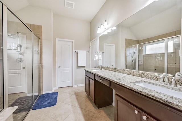 2012 Post Oak Ct, Pearland, TX 77581 - full bath with vaulted ceiling, a stall shower, double vanity, and tile patterned flooring