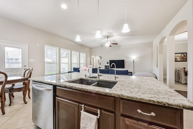 2012 Post Oak Ct, Pearland, TX 77581 - kitchen with dishwasher, open floor plan, arched walkways, decorative light fixtures, and ceiling fan