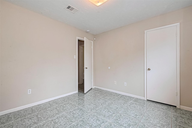 4307 Jura Dr, Houston, TX 77084 - unfurnished bedroom featuring tile patterned flooring and a textured ceiling